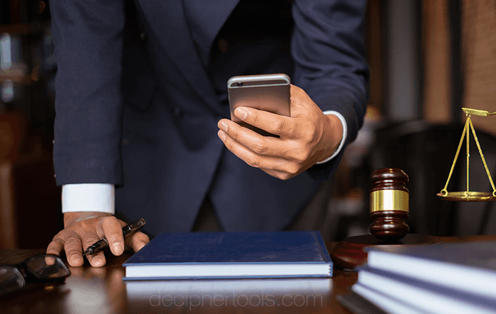 Lawyer in courtroom with mobile phone who might need to print text messages for court or for their client 