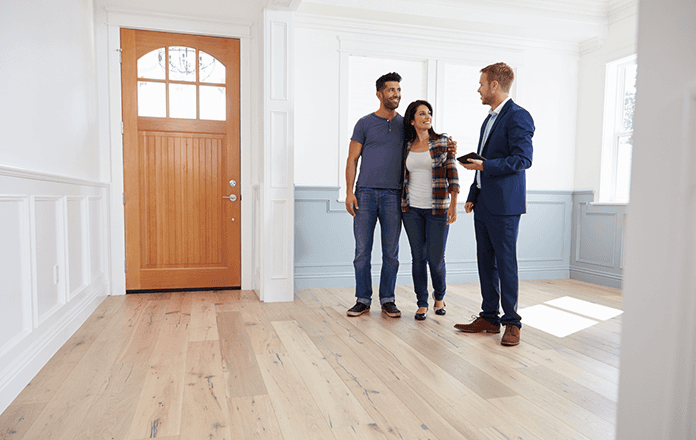 Realtor showing a couple a house that is for sale